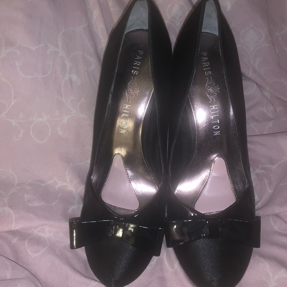 Paris Hilton black high heels